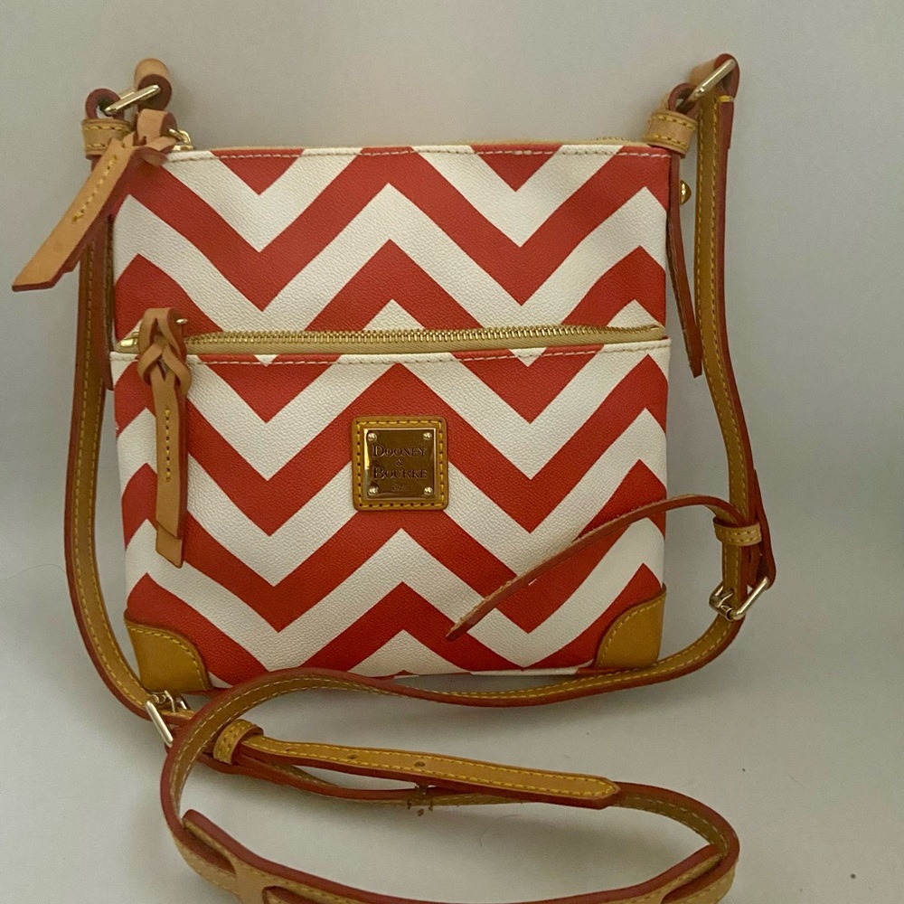 Dooney and Bourke leather crossbody in red zigzag pattern. New w/o tags.